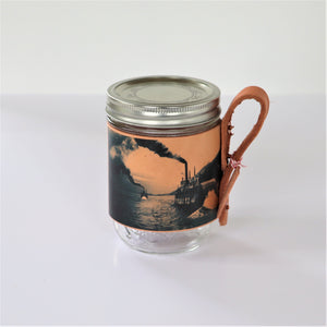 Mason jar sleeve with images from the Touchstones Nelson Archive